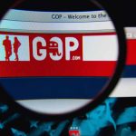 Magnifying glass over GOP website logo.