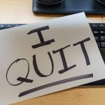 Paper with "I QUIT" on keyboard.