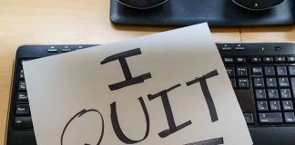 Paper with "I QUIT" on keyboard.