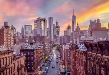 City skyline at sunset over busy urban street