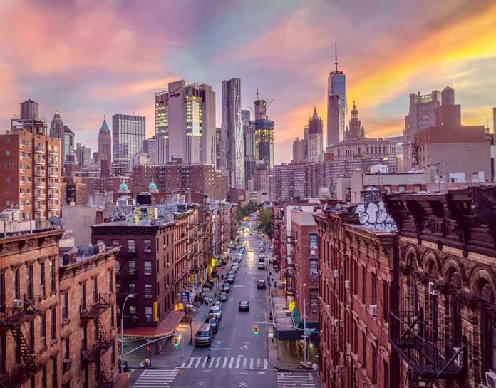 City skyline at sunset over busy urban street