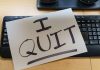 Paper with "I QUIT" on keyboard.