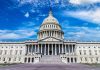 U.S. Capitol building with clear blue sky background.