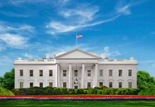 White House with American flag under blue sky