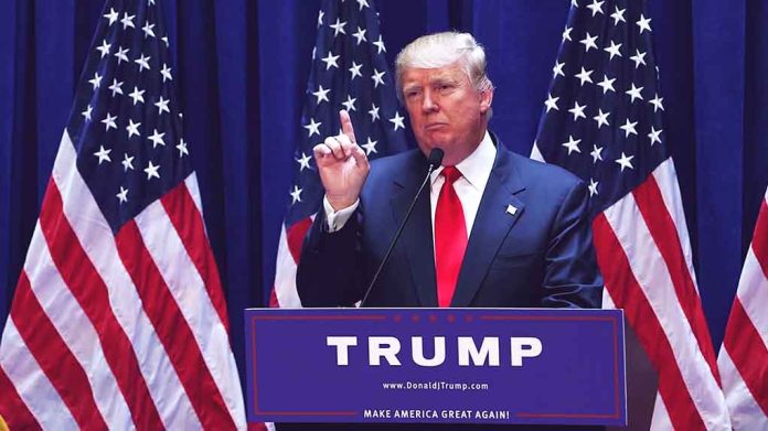 Man speaking at podium with American flags behind