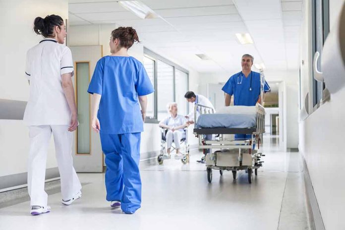 Doctors and nurses in hospital corridor with stretcher