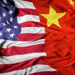 American and Chinese flags overlapping together