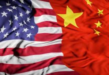 American and Chinese flags overlapping together