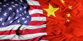 American and Chinese flags overlapping together