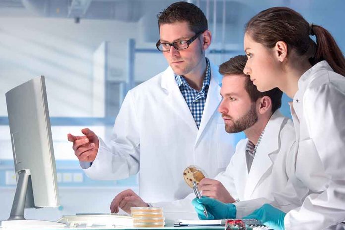 267953705 featured image Scientists analyzing data in a laboratory setting.