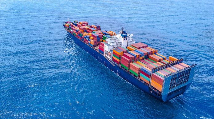 1457257346 featured image Cargo ship carrying colorful containers in open sea.