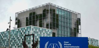 International Criminal Court building with sign in foreground