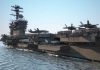 Aircraft carrier deck with jet planes.