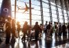 People in line at busy airport terminal