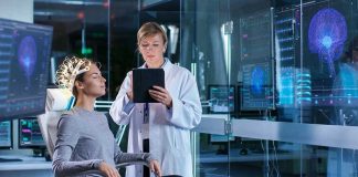 Woman undergoing brain scan with doctor monitoring results