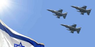 Israeli flag with three fighter jets in flight