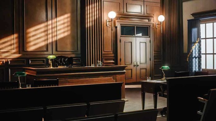 2056420760 Empty courtroom with wooden interior and green lamps