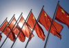 Red flags with yellow stars on flagpoles