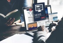 Person reading news on a laptop