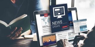 Person reading news on a laptop