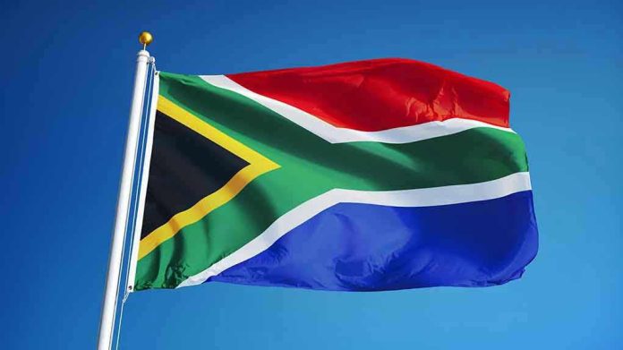 South African flag waving against blue sky