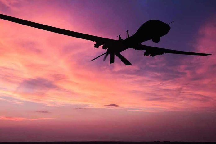 690489076 Silhouette of a drone against a colorful sunset.