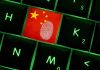 Close-up of a keyboard key featuring the Chinese flag and a fingerprint