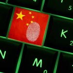 Close-up of a keyboard key featuring the Chinese flag and a fingerprint