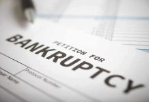 Petition for bankruptcy document with pen.