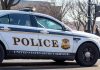 United States Secret Service police car on roadside.