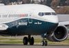 Boeing 737 MAX airplane on runway.