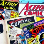 Assorted vintage Superman and Supergirl comic book covers.