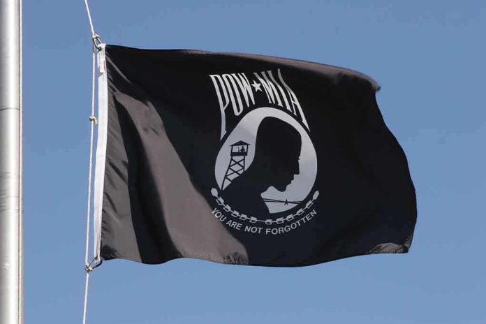 shutterstock_1088401.jpg POW MIA flag waving against a blue sky