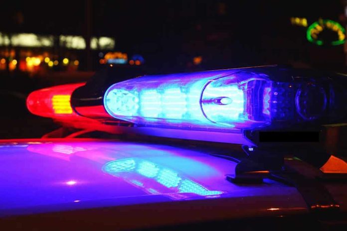 185887181 Police car lights flashing red and blue.