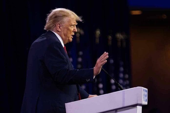 2322692285 Person speaking at a podium with hand raised