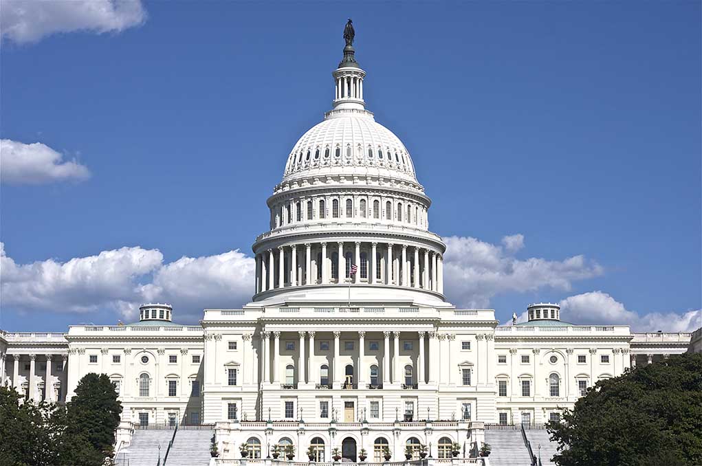 119536138 featured image U.S. Capitol building against blue sky.
