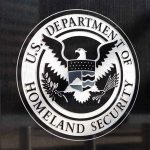 FBI and DHS Respond to Rising Threats Against Conservatives U.S. Department of Homeland Security emblem on wall.