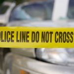 Jean-Pierre Maldera Assassinated Yellow police tape in front of a car.