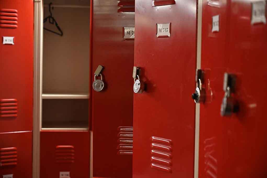 1862930638 featured image Red lockers with padlocks, one open with hanger.