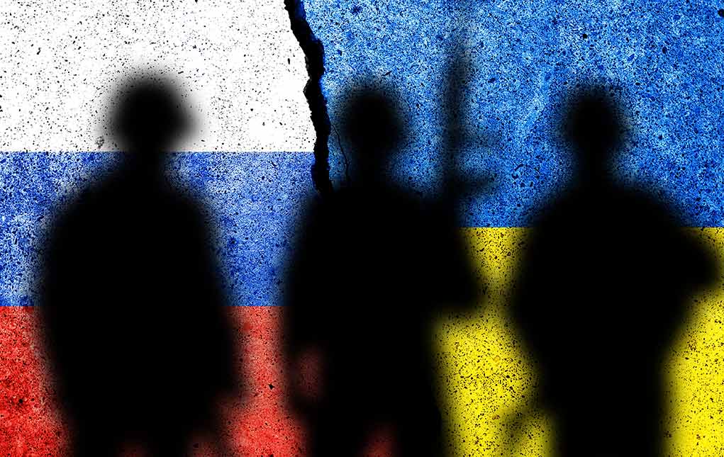 2095910923 featured image Silhouetted soldiers with Russian and Ukrainian flag backgrounds.