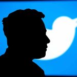 Musk’s Argument With Navarro Sparks Trade Policy Debate Silhouette of person with Twitter logo background