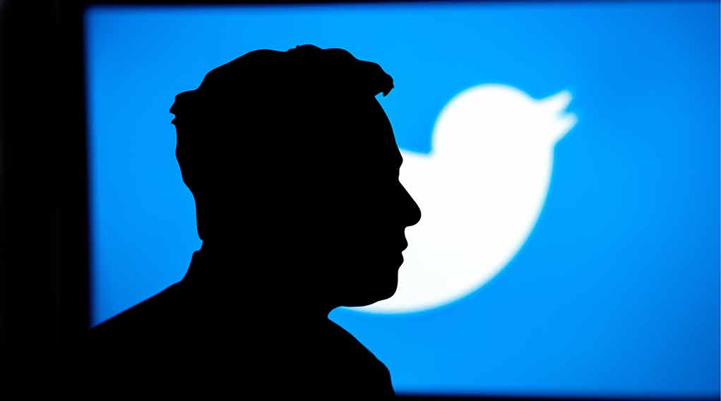 Silhouette of person with Twitter logo background