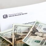 IRS Leadership Change Sparks Questions on Tax Data and Security Interface IRS letter with dollar bills nearby