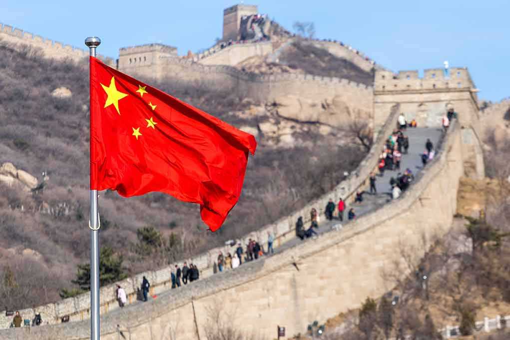 1145455832 featured image Chinese flag by the Great Wall of China