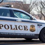 Cop SHOOTING Trial IGNITES Public Firestorm United States Secret Service police car on roadside.
