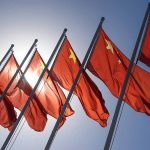 China’s Mineral Web HIDES Disturbing Abuse Red flags with yellow stars on flagpoles