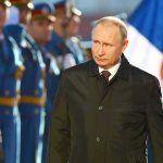 Putin’s Wheat Deal SHOCKS Asia — Why Now? A man in dark coat at a military event