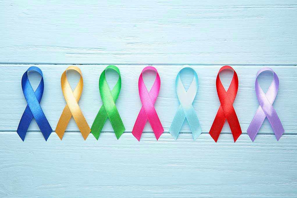 1564226551 Colorful awareness ribbons on light wooden background