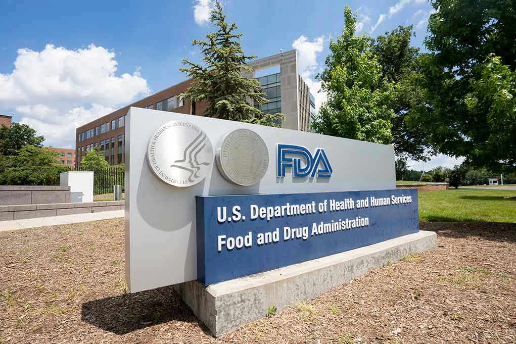 2186134561 FDA building sign with blue sky background