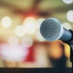 Microphone with blurred lights in the background